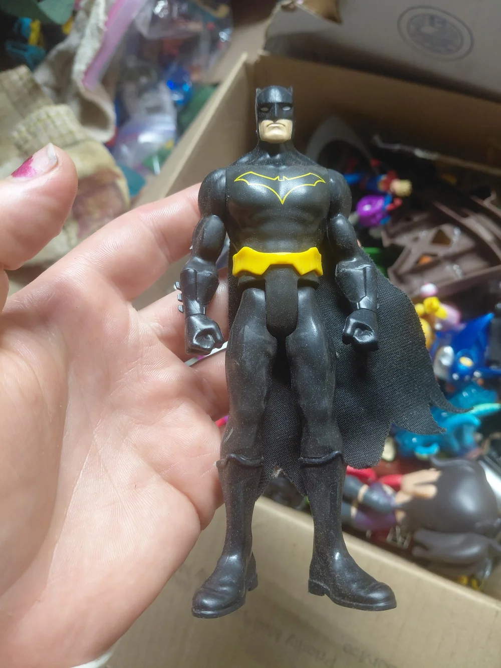 6-inch Mattel Justice League Batman action figure, recognized by its bright yell